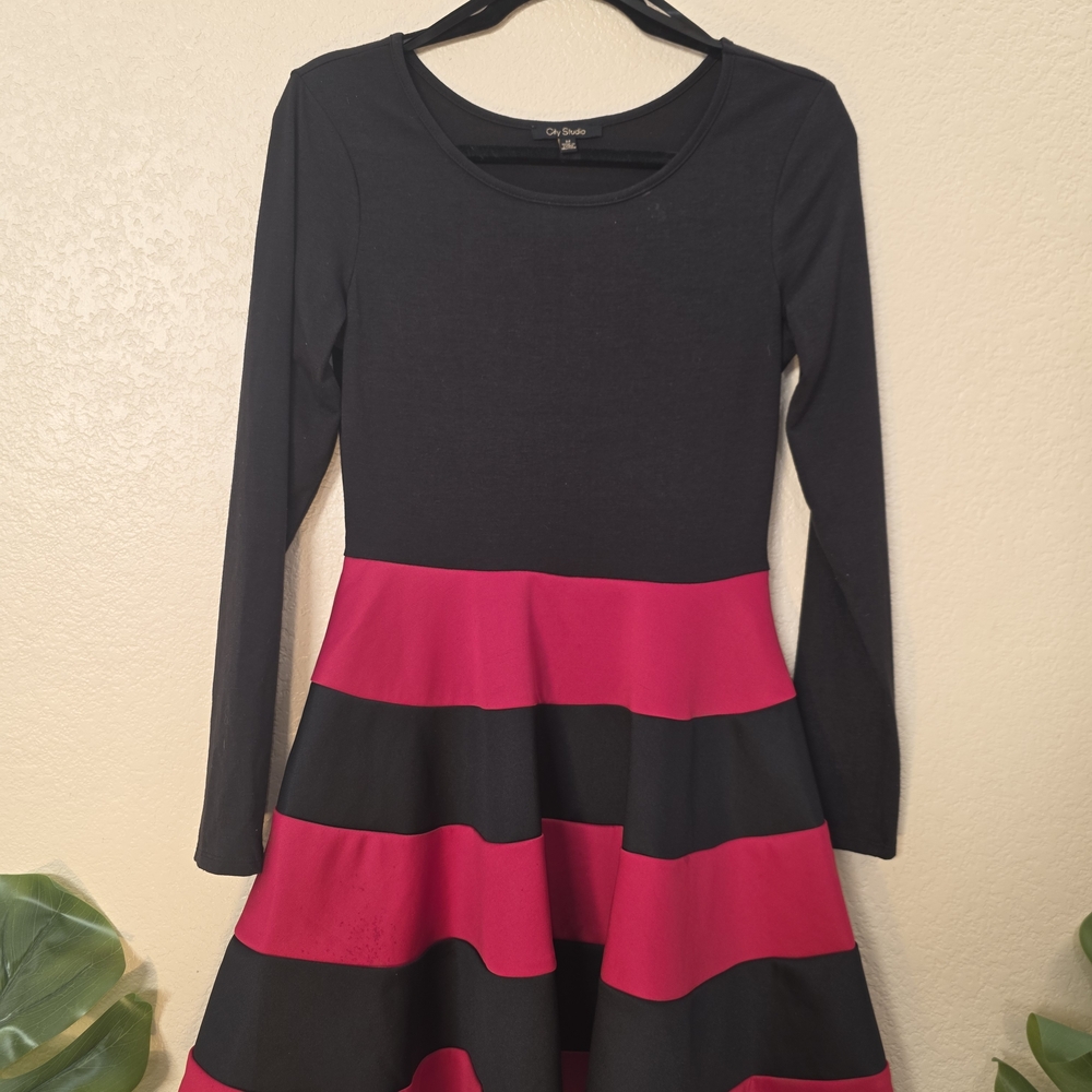 Bodice: The top section, including the long sleeves and the fitted upper bodice,
